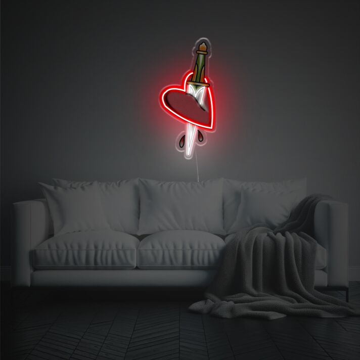 Add a Romantic Glow to Your Bedroom or Create the Perfect Atmosphere for Valentine's Day and Anniversaries with Red Heart Pierced By A Knife LED Neon Acrylic Artwork.