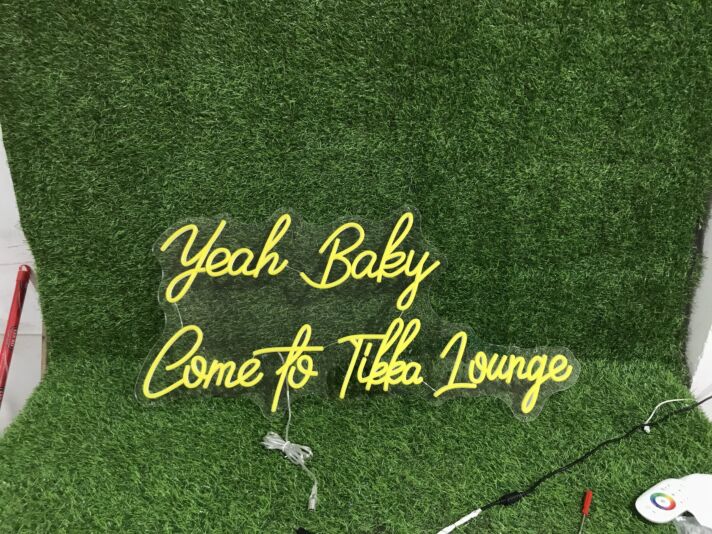 Brighten Up Your Bar, Restaurant, or Home Party Ambiance with the Yeah Baby Come To Tikka Lounge Yellow LED Neon Sign.