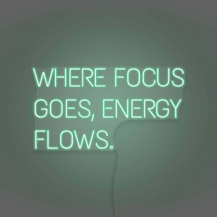 Where Focus Goes Energy Flows Neon Lettering Inspiring Concentration and Success