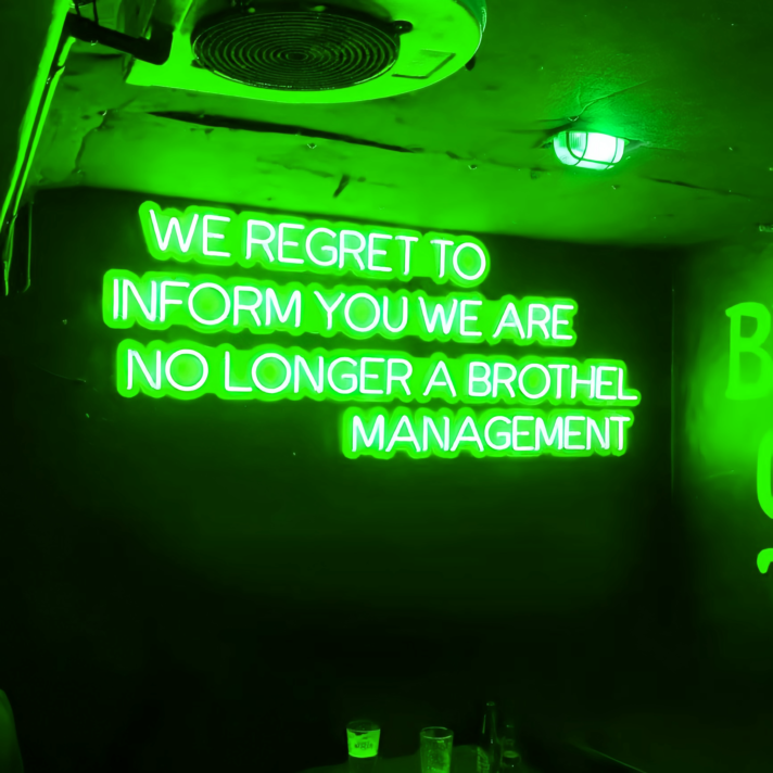 We Regret to Inform You We Are No Longer a Brothel Management Neon Sign: Changing Times in Neon