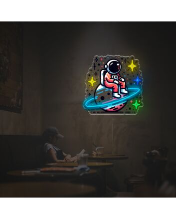 Elevate your space with Astronaut Sitting On The Planet LED Neon Acrylic Artwork – Perfect for home decor, trendy office settings, and sci-fi themed bars.