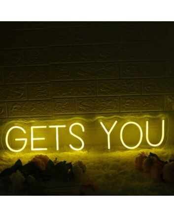 GETS YOU Yellow Neon Sign
