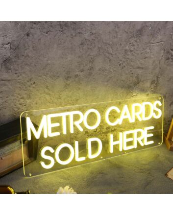 Metro Cards Sold Here Yellow Neon Sign