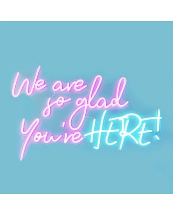 We Are So Glad Youre Here Neon Sign creates a welcoming atmosphere