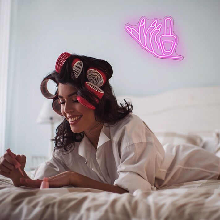Brighten Up Your Beauty Salon or Home Vanity with the Deep Pink Hands Holding Nail Polish Neon Sign.